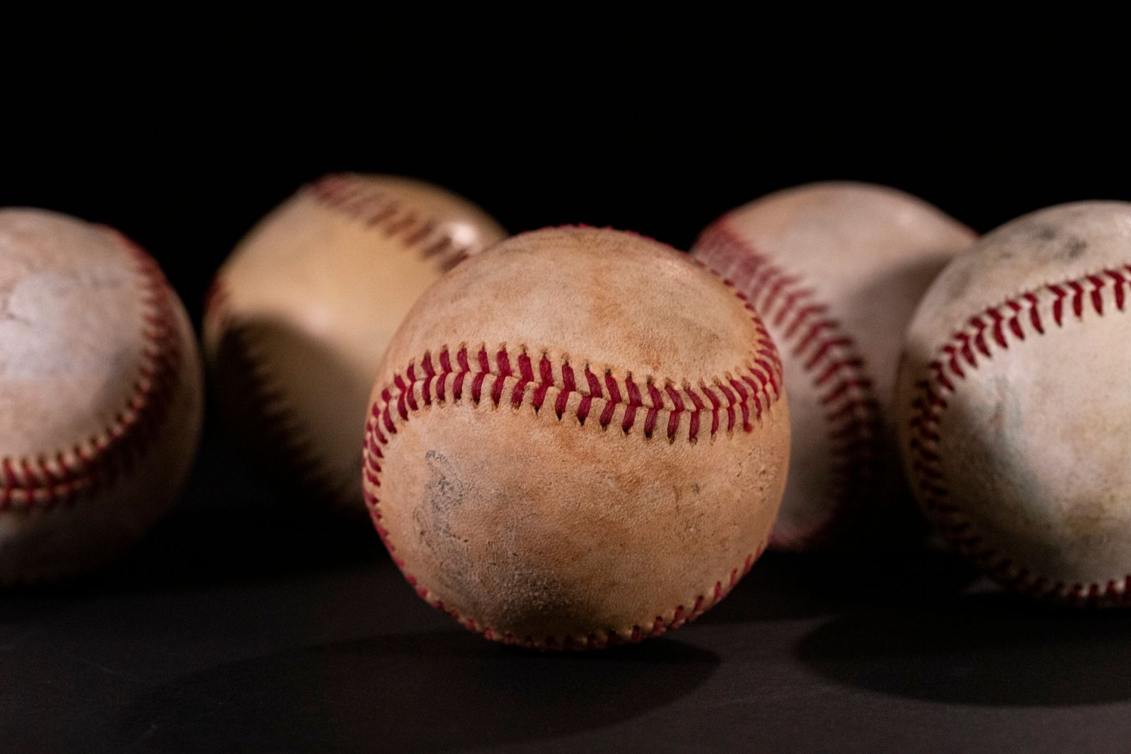 Baseballs arranged as part of a multi-sport collection