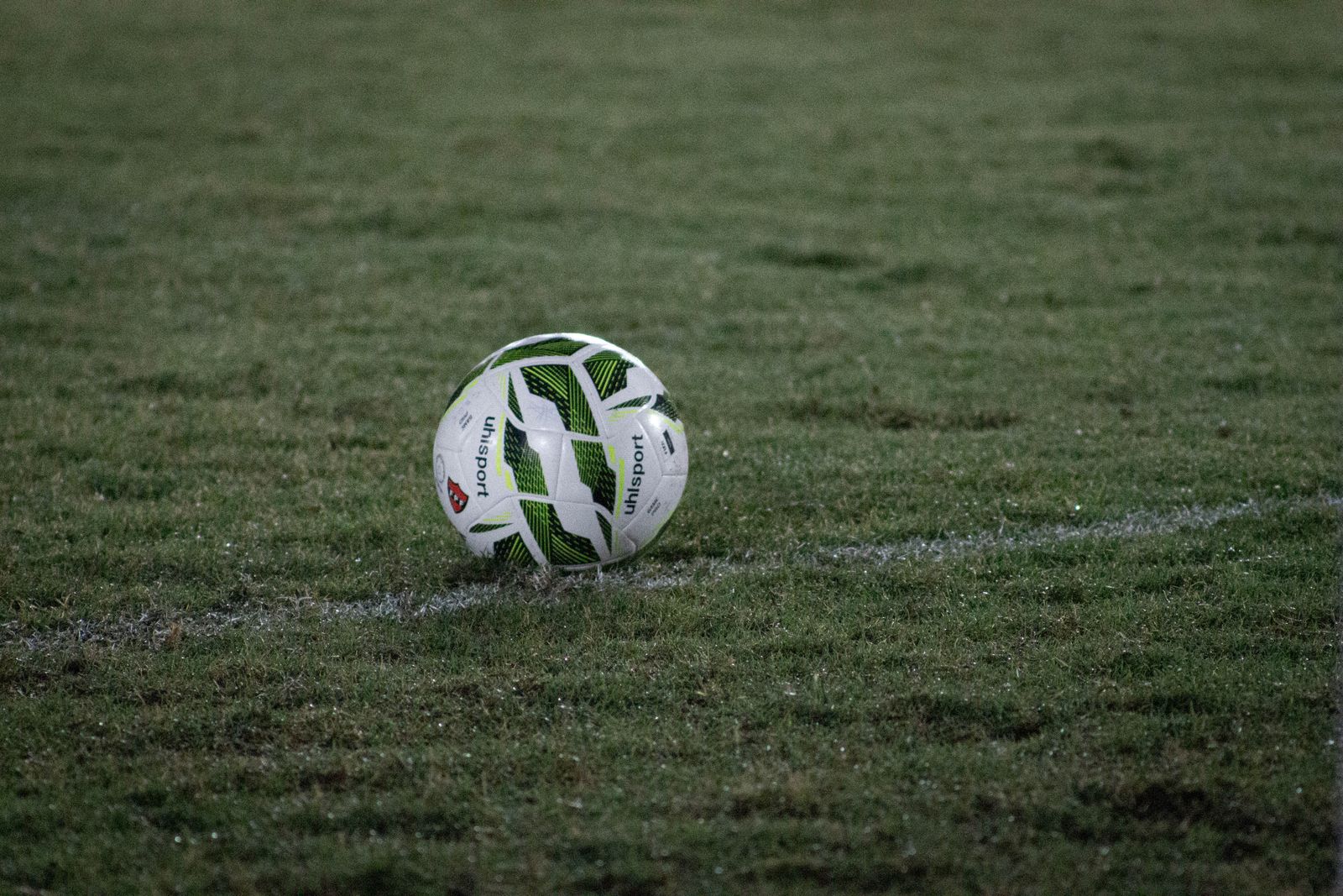 Soccer ball on a grass pitch